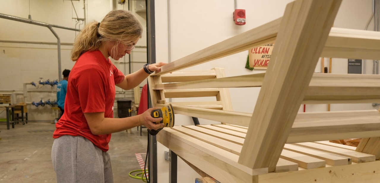 Industrial Design student building furniture in the lab.