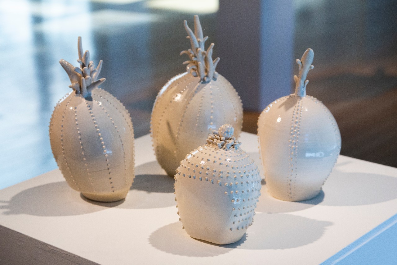 Wheel thrown mid-range clay, slip trailed pattern, hand built sculpted ceramic blossoms