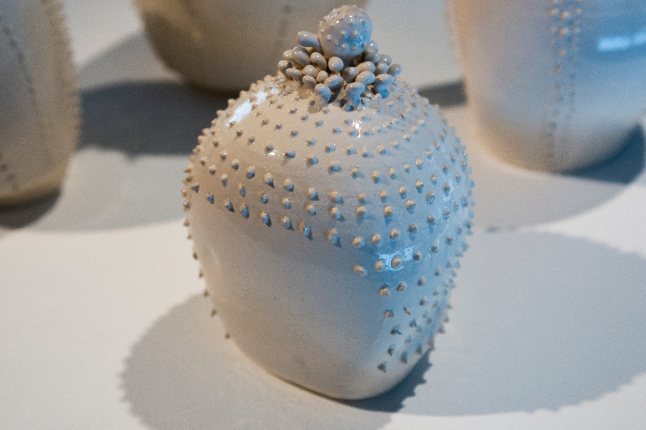 Wheel thrown mid-range clay, slip trailed pattern, hand built sculpted ceramic blossoms