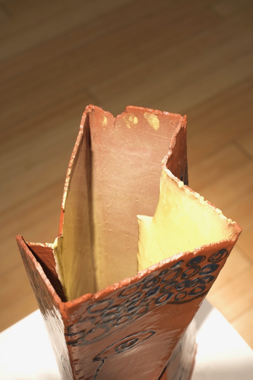 tall rectangular geometric earthenware vessel