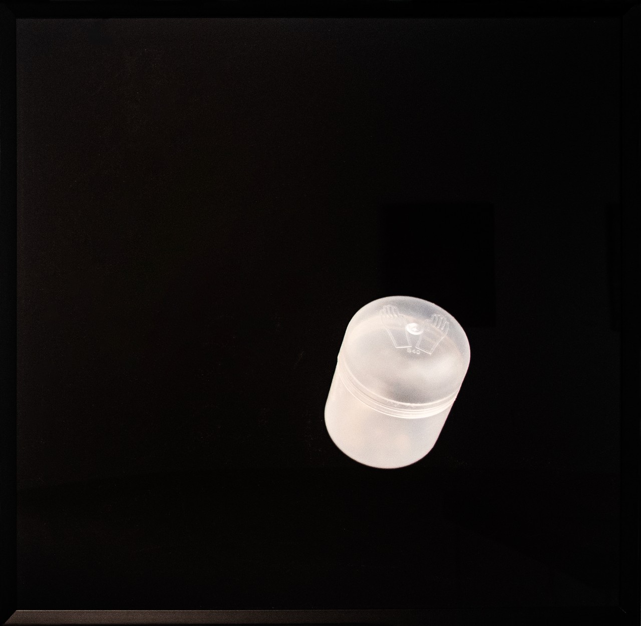 Image of plastic container of fur