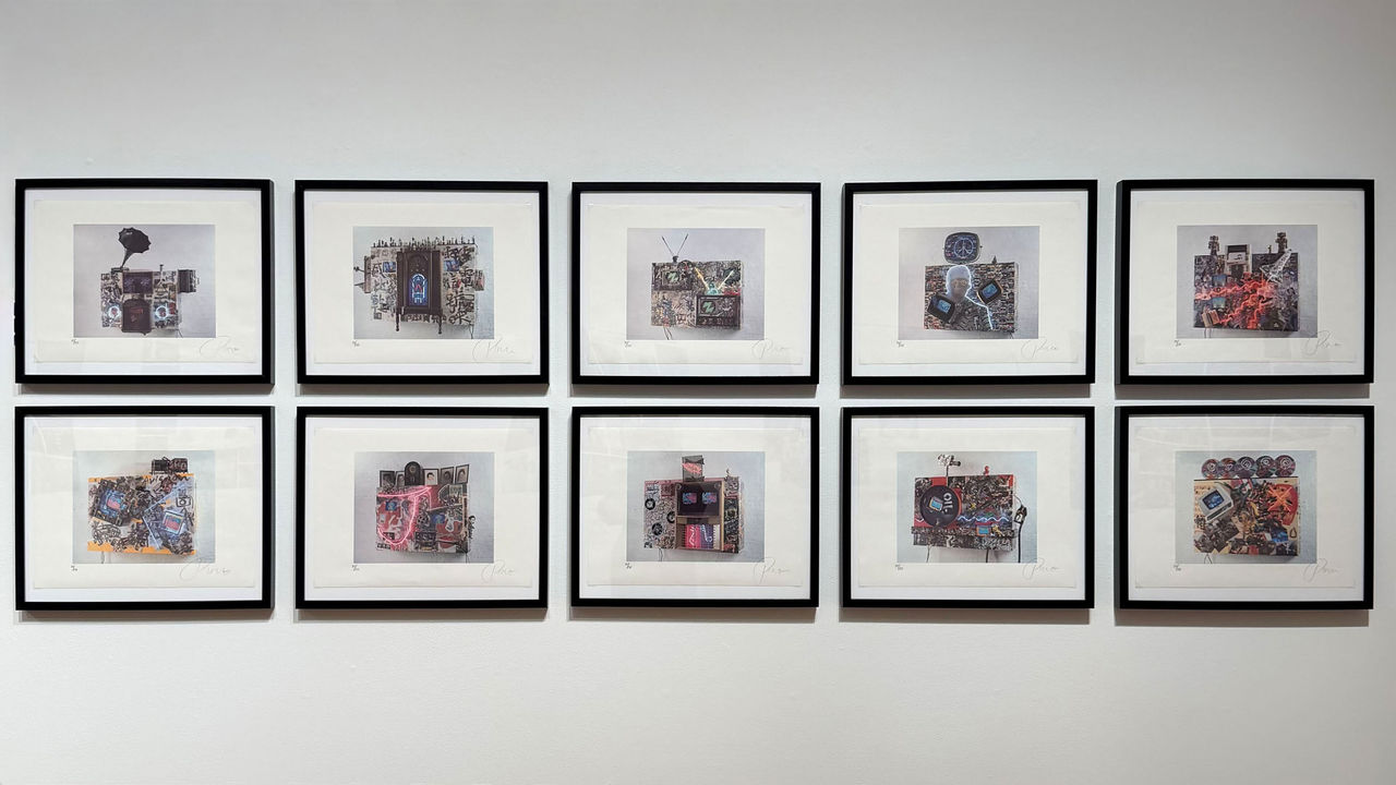 Installation view of ten framed lithographs arranged in two rows on a white wall, each depicting a mixed media sculpture with televisions, collage imagery, and neon elements