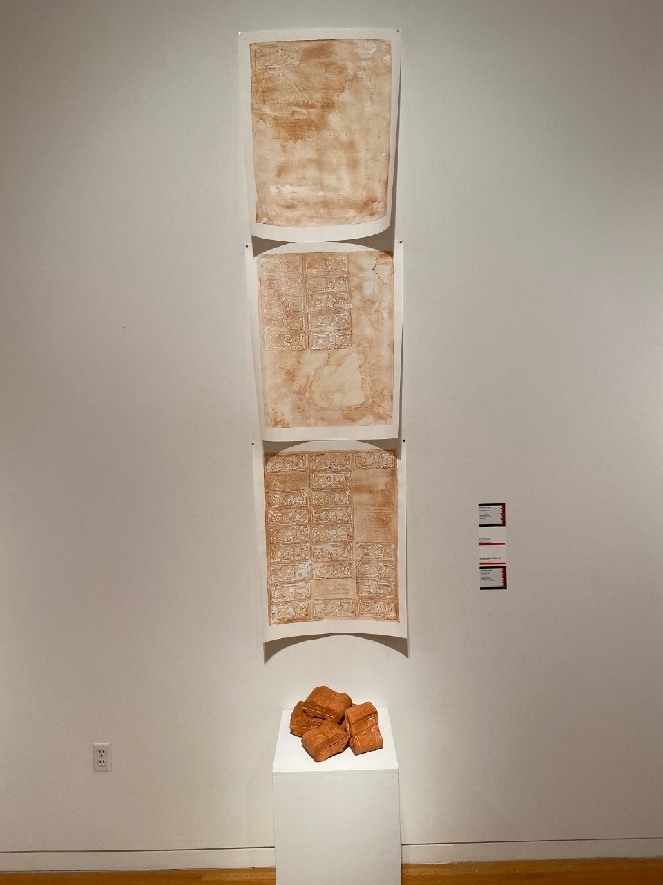 terra cotta money stamps on paper