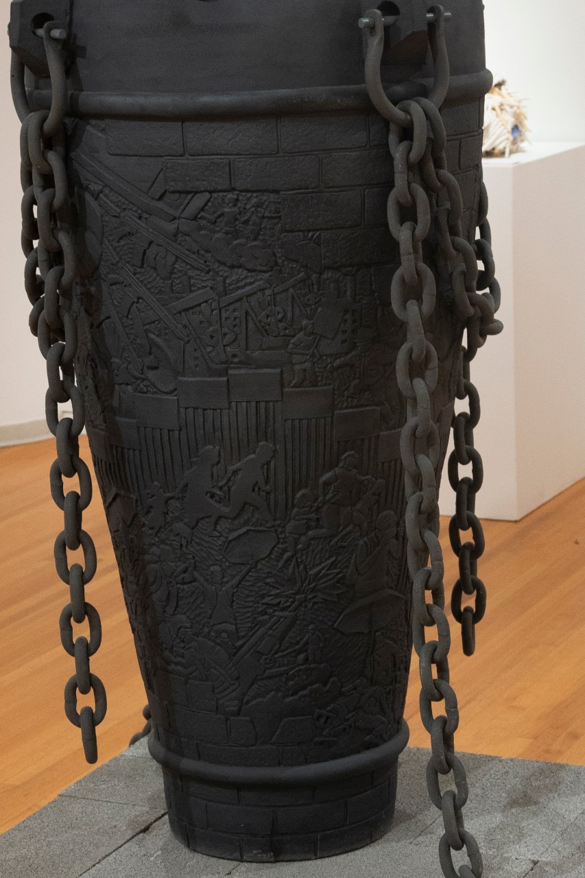 large tall gray ceramic chained tapered casket