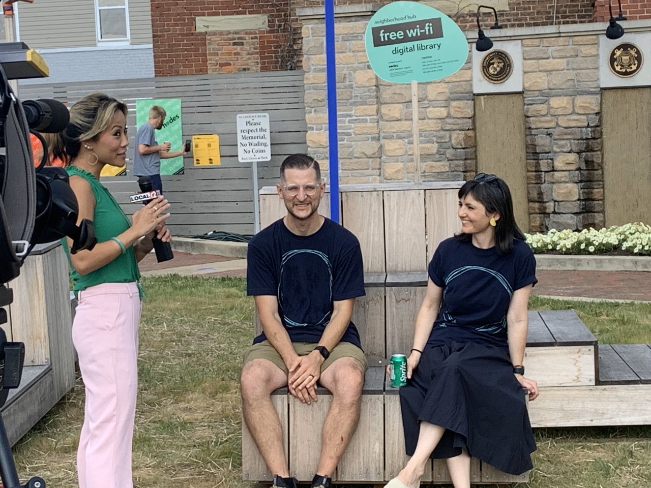 Photo of Local Channel 12 News interview of DJ Trischler and Anca Matyiku